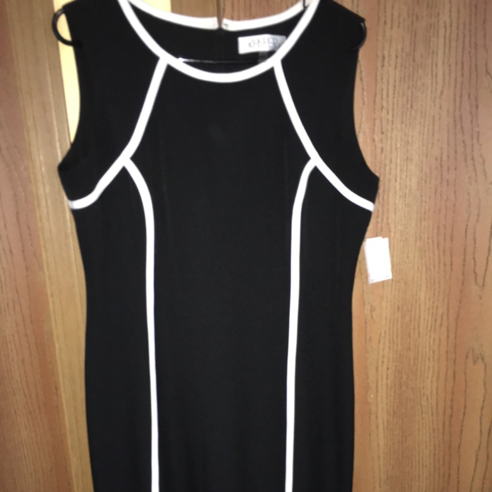 Kasper black sheath dress with white piping.